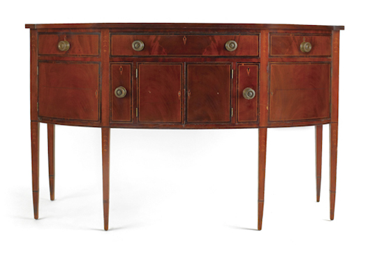 New England Federal mahogany sideboard, circa 1790, with a D shaped top, bellflower inlays and square tapering legs. Image courtesy Pook & Pook Inc.